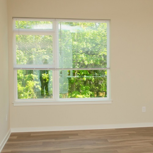 Bedroom with natural lighting and plank flooring Bedroom with natural lighting and plank flooring
